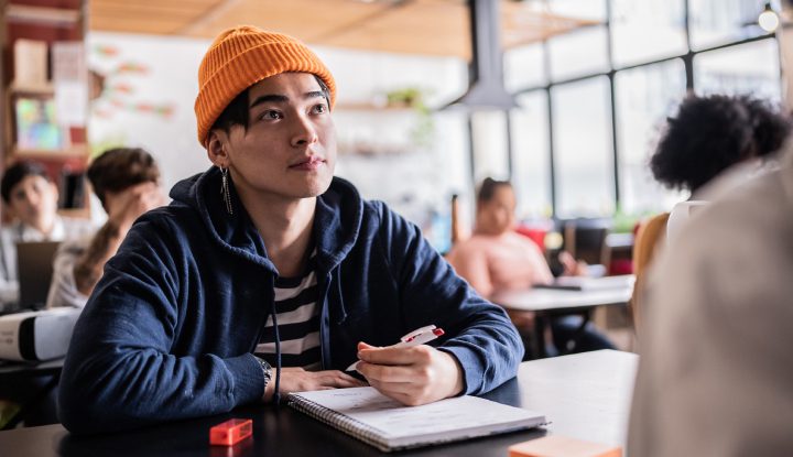 Young man looking up in class